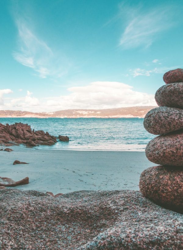gray rocks on seashore during daytime